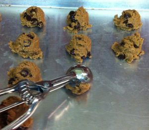 scooping chocolate chip cookies
